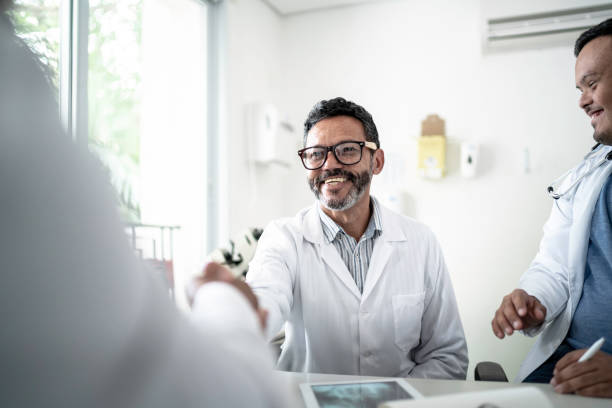 istock Doctors on a handshake during conference / meeting 1201264904