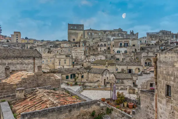 Matera, Ancient Italian Town in Southern Italy with Moon in the Sky