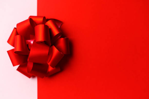 istock Festive beautiful red bow on a double background. 1201265345