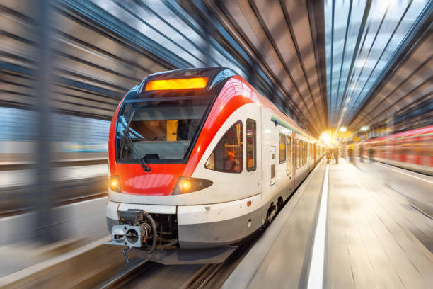 istock Passenger high speed train with motion blur in station. 1201268109
