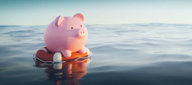 piggy bank on lifebuoy, 3d render - water crisis photos et images de collection