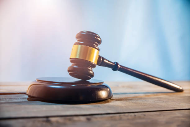 istock the judge's hammer on wooden table 1201269281