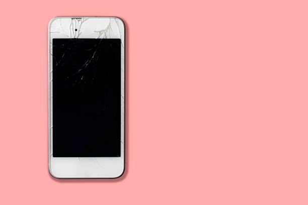 istock Smart phone glass is broken on pink background 1201269352