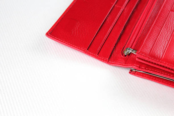 istock Red leather open purse lies on white surface. 1201270936