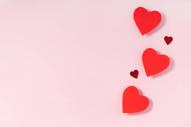 istock Valentine's day frame composition. Red hearts on pastel pink background. Top view, flat lay, copy space 1201273281