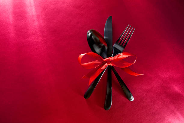 istock Celebration set of silverware wrapped in red ribbon for Valentine's Day 1201275346