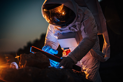 Astronaut taking rock samples on Mars