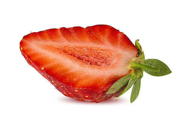 istock Strawberry halved isolated on white background with clipping path 1201275994
