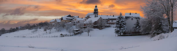 istock Little german snow-covered village at sunrise 120127687