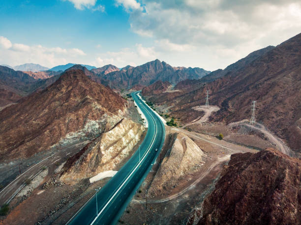 istock Scenic road through Hajar mountain range stretching through UAE and Oman 1201279907