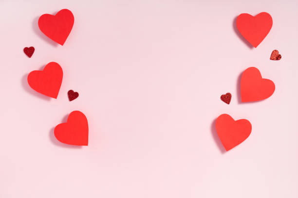 istock Valentine's day frame composition. Red hearts on pastel pink background. Top view, flat lay, copy space 1201280134