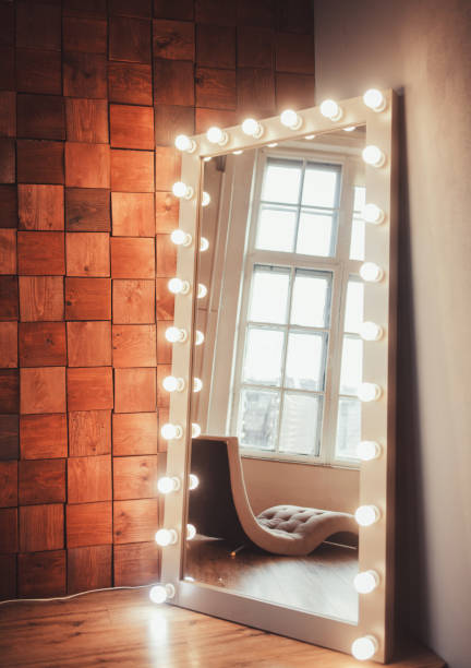 istock mirror with light bulbs against a wooden wall 1201280420