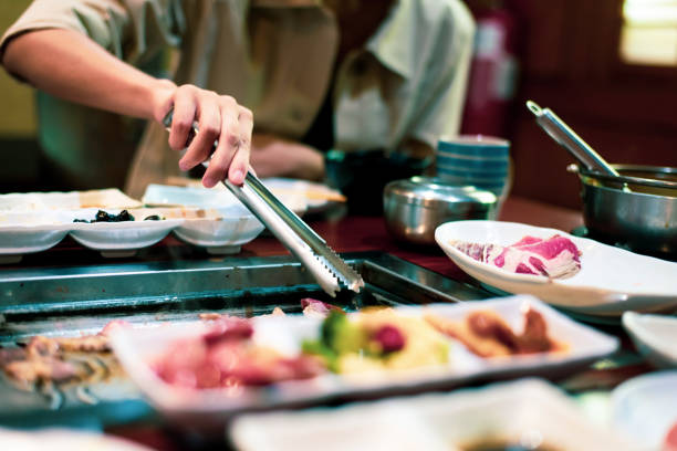 istock Person having Korean barbeque in the restaurant 1201280540