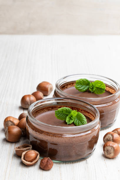 istock Homemade chocolate hazelnut praline in glass jar isolated on white 1201280550