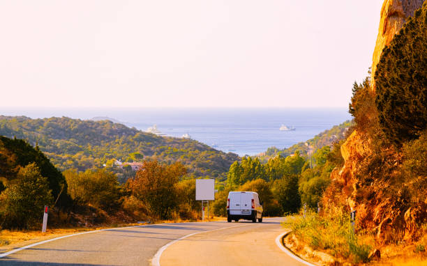 istock Mini van on road in street in Sardinia reflex 1201280656