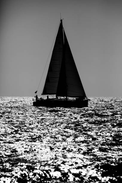 istock Yacht silhouette in the high sea on sunset 1201282004
