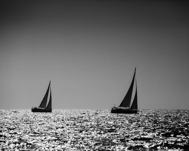 istock Yacht silhouette in the high sea on sunset 1201282665