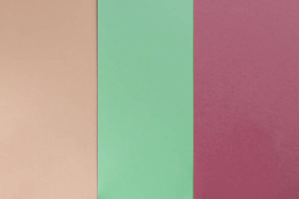 istock Beige green bordo colored paper background. Geometric flat composition. Empty space on monochrome cardboard. 1201284010