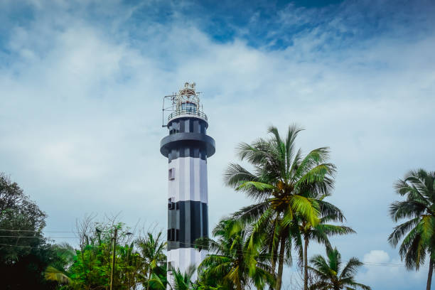 istock Lighthouse among tropical palm trees in Kerala. India 1201284028