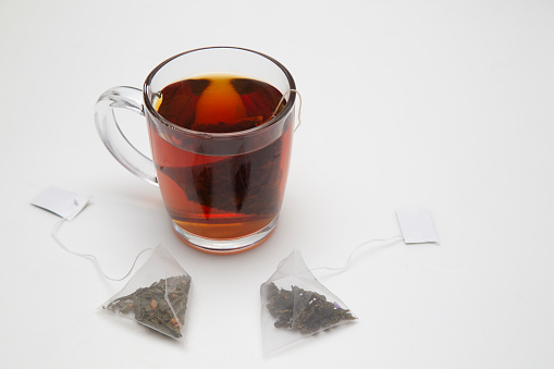 Tea bag. Tea in pyramid bags. Tea for quick use.