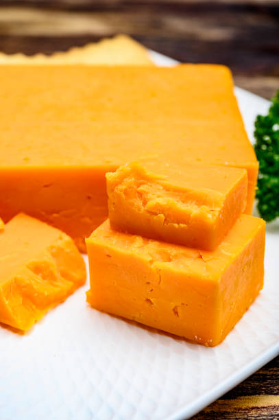istock Leicestershire cheese or red leicester, British hard cheese made from cow milk 1201286037