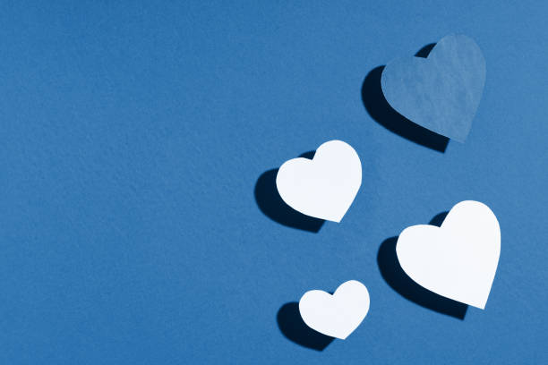 istock Valentine's day frame composition. Blue paper hearts on blue background. Top view, flat lay, copy space 1201286932