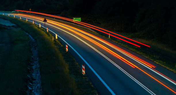 istock lights of cars with night 1201288975