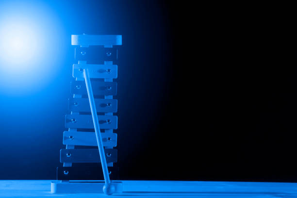 istock Xylophone isolated on black background. Blue filter 1201289094