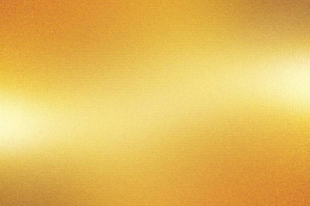 istock Orange foil metal wall with glowing shiny light, abstract texture background 1201292523
