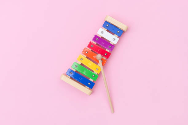 istock Colour xylophone isolated on pink background 1201292940