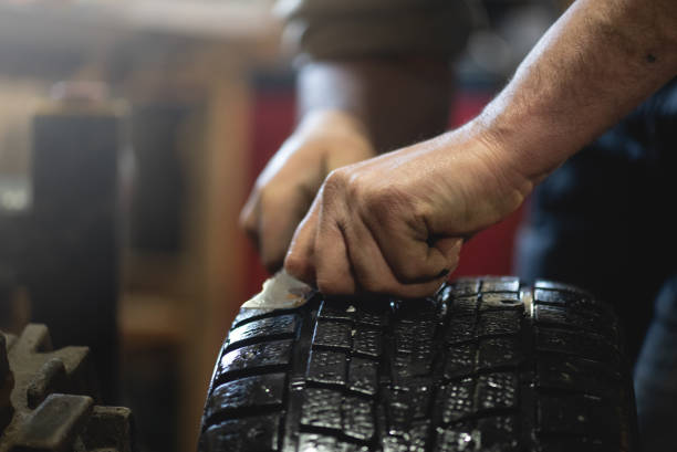 istock Car tire repair. 1201294123