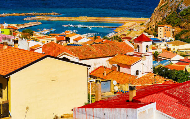 Buggerru city architecture Mediterranean Sea in South Sardinia reflex Cityscape with Buggerru city with cottage house architecture at the Mediterranean Sea in South Sardinia in Italy. Sardinian Italian small town in Sardegna. Buggerru stock pictures, royalty-free photos & images