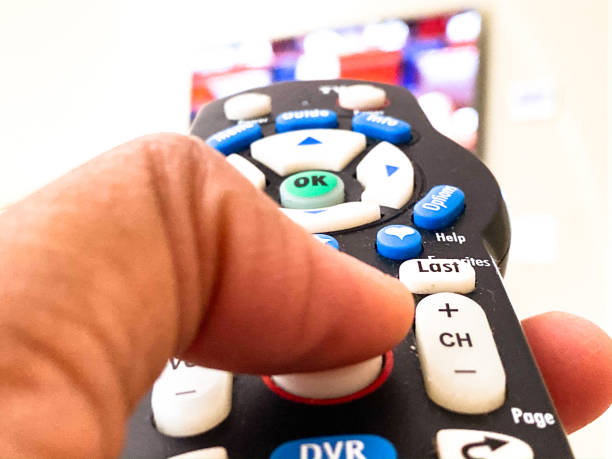 African-American Female Holding Television Remote Control