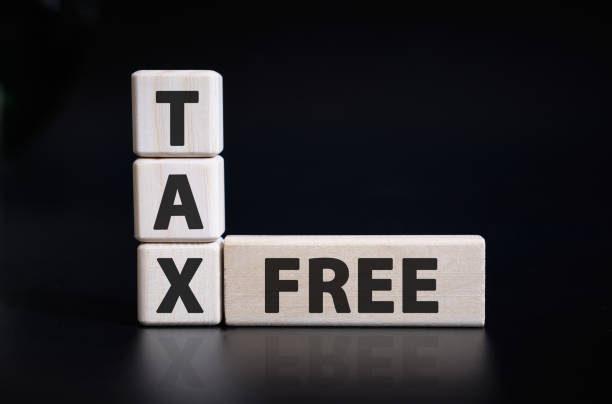 istock Tax and Free text on cubes lying on the keyboard 1201296278