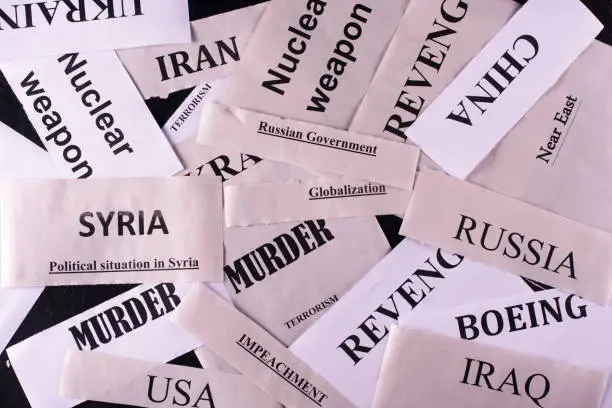 Sheets of paper with words reflecting the political situation in the world.