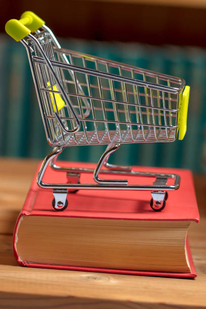istock Books and a shopping cart 1201297122