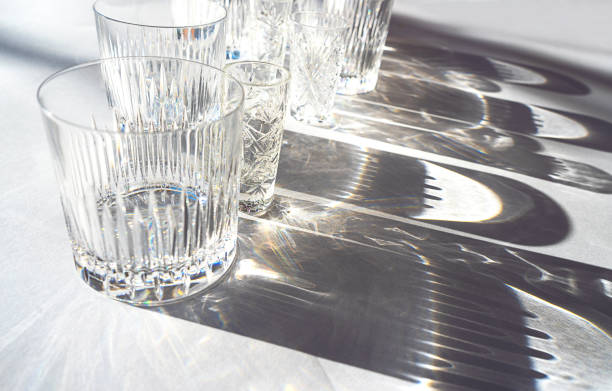 istock Trendy pattern made with glasses and shadows on gray white background. 1201297279