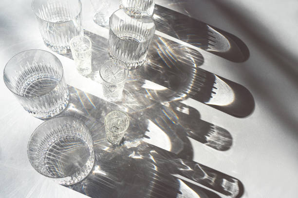 istock Trendy pattern made with glasses and shadows on gray white background. 1201297284