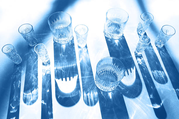 istock Trendy color pattern made with glasses and shadows on classic blue background. 1201297583