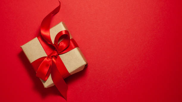 istock Gift box brown paper with satin ribbon bow directly above 1201297607