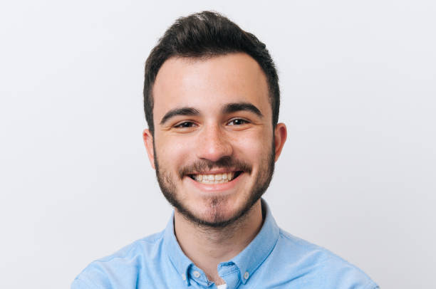 istock A smiling face of young man over white background 1201302385