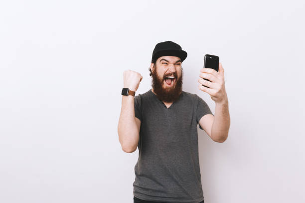istock Screaming bearded man is gesturing with hand, Winner man . 1201303627