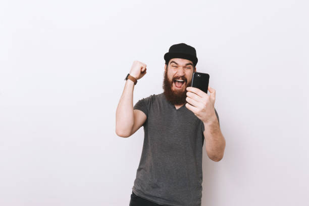 istock Amazed bearded man about his first online casino victory 1201303649