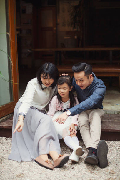 istock Asian Family Portrait in Front Yard 1201303933