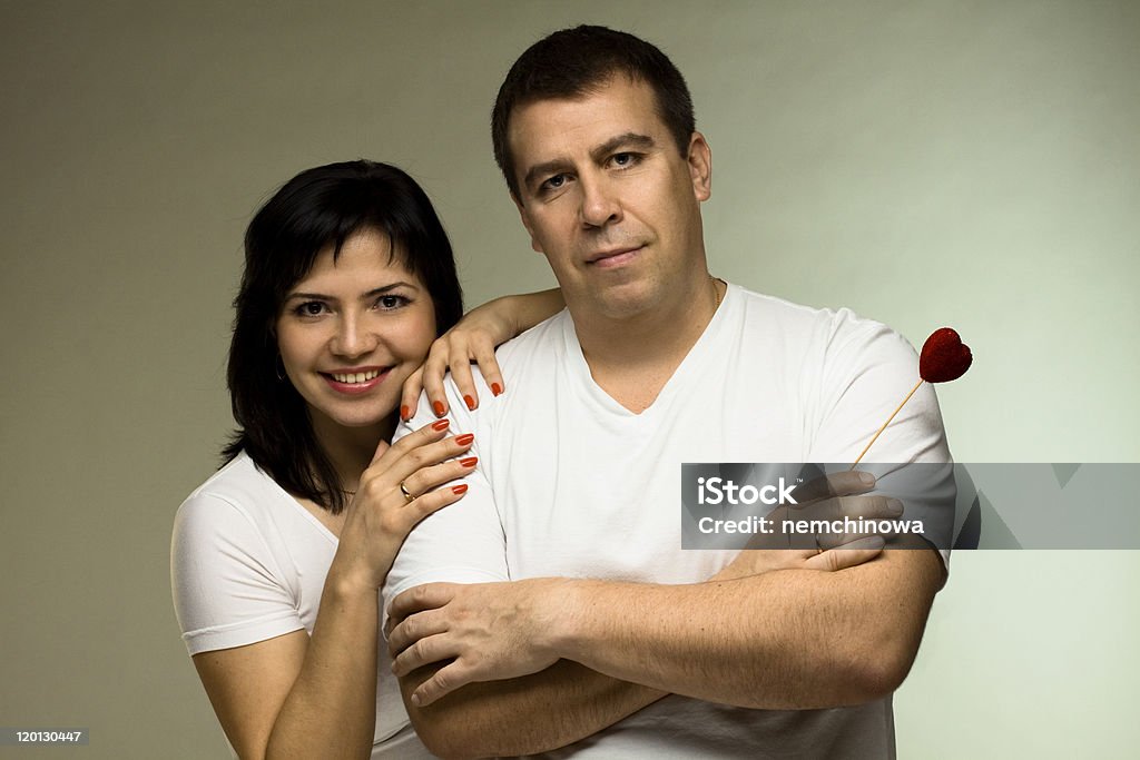 Beautiful couple with red heart Beautiful couple with red heart - love concept Adult Stock Photo