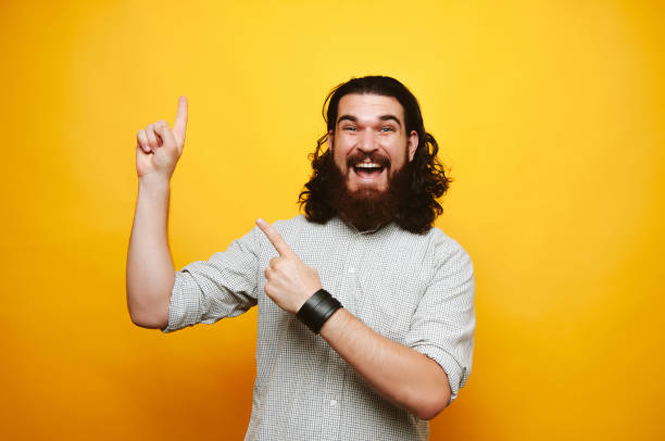 istock Happy hipster bearded man showing up to copy past 1201305018