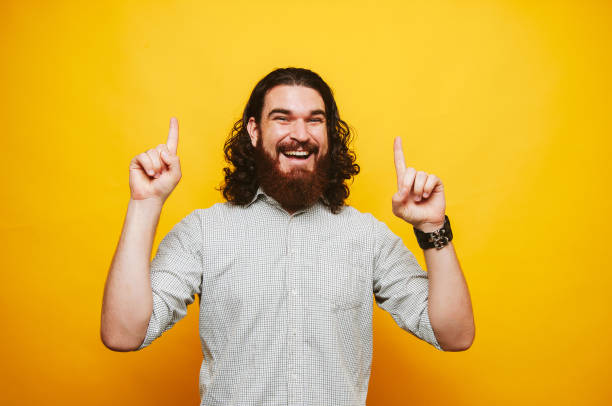 istock Bearded hipster man in shirt showing to get up 1201305095