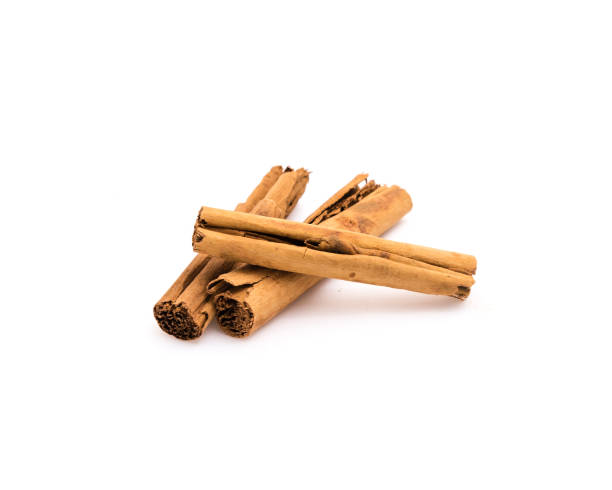 istock Studio shot three raw dried organic cinnamon sticks isolated on white 1201305284