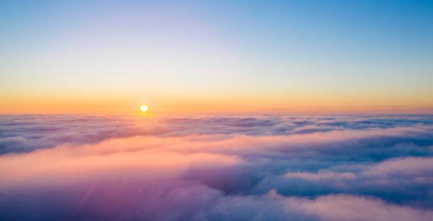 istock Yellow and blue dawn over clouds, concept, travel and leisure. 1201305451