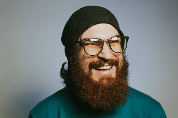 istock Smiling bearded man in glasses 1201306185
